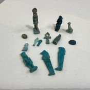 Egyptian antiquities: a standing aubergine glazed figure of Sekhmet, a turquoise glazed figure of