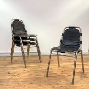 Style of Charlotte Perriand, a set of four stacking dining chairs, 1970's, each tubular frame with a