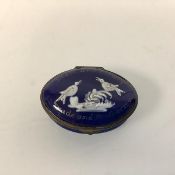 An 18th century Staffordshire enamel patch box, oval, decorated with the motto "Peace and Plenty,