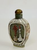 A Chinese mother-of-pearl and carved hardstone snuff bottle, carved to one side with a panel