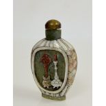 A Chinese mother-of-pearl and carved hardstone snuff bottle, carved to one side with a panel