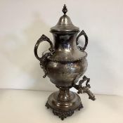 A 19th century silver-plated urn of Samovar type, the domed cover with urn finial, the