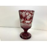 A 19th century Bohemian ruby flash glass goblet, the bowl wheel-engraved with deer in a wooded