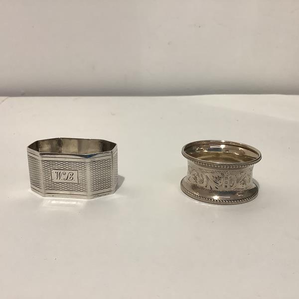 Two silver napkin rings, one circular, Birmingham 1925, the other shaped octagonal, Birmingham 1966.