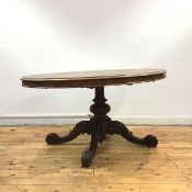 A mid-19th century rosewood snap-top breakfast table, the oval top and moulded frieze on bulbous