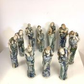 Lorraine Fernie (b. 1941), Ten Gossips, ten female figures, stoneware in cobalt and copper glazes,