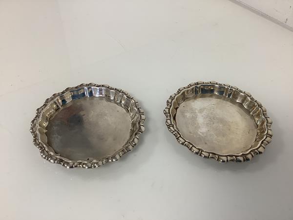 A pair of George V small silver bottle coasters, Goldsmiths & Silversmiths Company, London 1911,