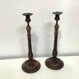 A pair of George III style brass-mounted mahogany candlesticks, c. 1900
