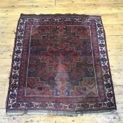 A Feraghan rug, the blue field with central madder medallion within complimentary spandrels,