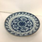 A Delft blue and white dish, late 18th century, the well painted with a geometric roundel within a