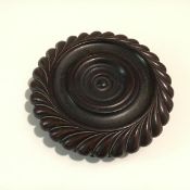 A George IV mahogany wine coaster attributed to James Mein of Kelso, of circular dished form with