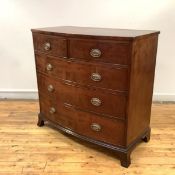 A Regency mahogany bowfronted chest, two short and two long drawers, raised on splayed bracket feet.