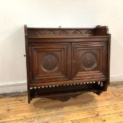 In the manner of Thomas Jeckyll, an oak hanging cabinet, c. 1860's, with raised gallery