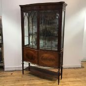 An Edwardian mahogany and inlaid display cabinet bearing label for Charles Jenner & Co.,