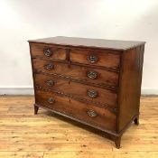 A late George III mahogany chest, c. 1800, of two short and three long drawers, raised on slender