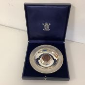 Royal Mint: a Britannia silver "coin" dish, by Christopher Nigel Lawrence, London 1997, inset to the