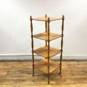 An unusual 19th century satinwood four-tier etagere, with turned finials and baluster shaped