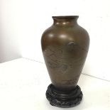 A Japanese bronze vase of urn form and decorated with a scene of Mount Fuji, Sailboats and a