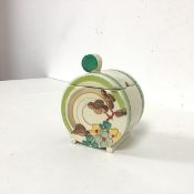 A 1920s/30s Clarice Cliff lidded condiment of circular form with foliate polychrome decoration (chip