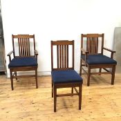 A set of eight oak dining chairs, c.1930, enclosing two armchairs of different sizes and six hand