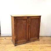 A 19thc stained deal pantry cupboard, the rectangular top with rounded corners and moulded edge