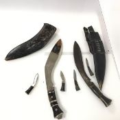 A pair of Gurkha kukri, one most likely ceremonial, both complete with sheaths and additional