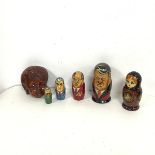 Two sets of Russian babushka dolls, one set in the form of Russian leaders including Stalin, Lenin