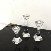 A graduated set of three crystal Villeroy & Boch candlesticks, the octagonal top converges into a