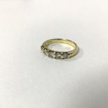 An 18ct gold five stone diamond ring (O) (3.82g)