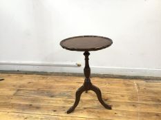 A reproduction mahogany wine table in the George III style, the circular top with piecrust moulded