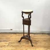 A mahogany washstand of George II design, early 20thc., with associated ceramic bowl, on scroll