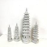 A collection of four modern blanc de chine decorative pagodas with balconies. (tallest: 41cm) (4)