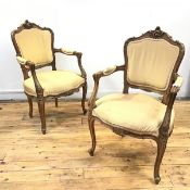 A pair of French early 20thc fruitwood fauteuil, each cartouche shaped back with scrolling crest,