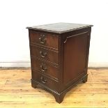 A mahogany filing cabinet in the George III style, the rectangular top with tooled leather inset