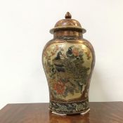 A Chinese Kutani style baluster vase, the lid with knop finial above reserves of exotic birds with