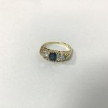 An 18ct gold sapphire and diamond foliate cluster design ring (N) (2.7g)