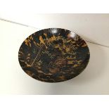 A 1900- 1920's tortoiseshell gilt lacquer footed bowl depicting cranes with bamboo (h.7cm x d.24cm)