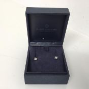 A pair of white metal stud earrings set with princess cut diamonds, complete with box (2.16g)