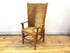 An oak framed Orkney chair, the woven straw back within angled supports above a quarter woven