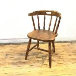 An early 20thc country style chair, with hoop back and laminated seat, on turned legs with