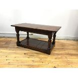 An oak occasional table, apparently made from old railway sleepers, the rectangular plank top raised