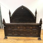 An And So To Bed moulded wood and Gothic inspired double bed, the lancet shaped headboard with