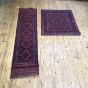 A hand knotted rug of North West Persian design, the madder field with central lozenge and radiating