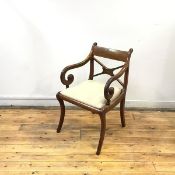 A Scottish Regency mahogany elbow chair, the tablet back and X frame rails with later cartouche