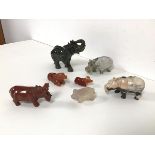 A collection of carved hard stone animals including an elephant (h.9cm x 12cm x 5cm), three