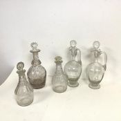 A collection of glass decanters and claret jugs (claret jugs: h.30cm x d.11cm) (5)