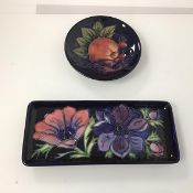 A rectangular Moorcroft dish with floral decoration, stamped Moorcroft to base, (20cm x 9cm x 8cm)