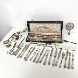 A collection of Epns including escargot forks, butter knives, fish knives, grape scissors, berry