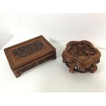 A Chinese cherrywood fretwork rectangular stand, the central foliate motif with bats to each