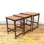 A good quality set of three teak graduated tables, mid century, possibly Danish, each with